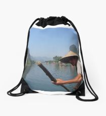 Cruising the mountains of Yangshuo Drawstring Bag