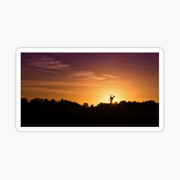 Windmill Sihouetted By The Setting Sun Sticker