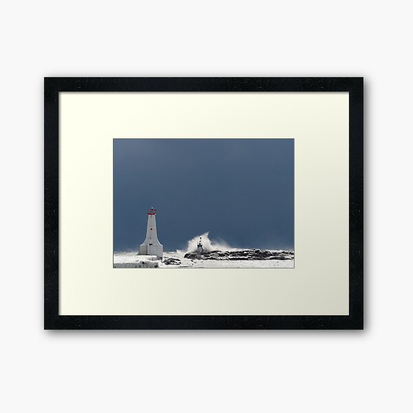Frozen Lighthouse Facing the Storm Framed Art Print