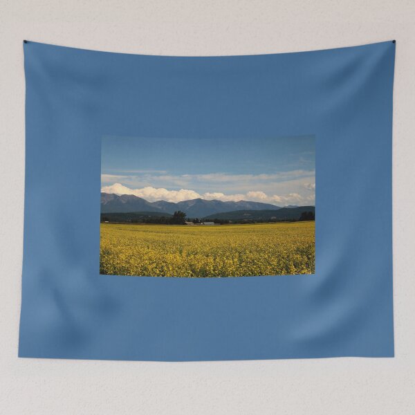Item preview, Canola fields in bloom against the Swan Mountain range in the Rocky Mountains of Montana  designed and sold by LCAppling.