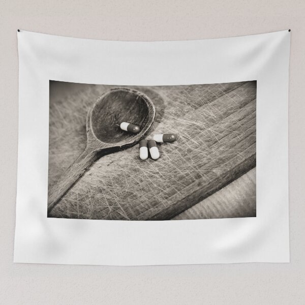 Item preview, Capsules taplets pill on wooden spoon close up designed and sold by Claraveritas.