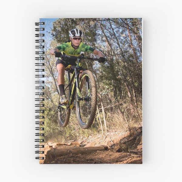 Item preview, Mountain biker getting air on a single track designed and sold by Dan Edwards.