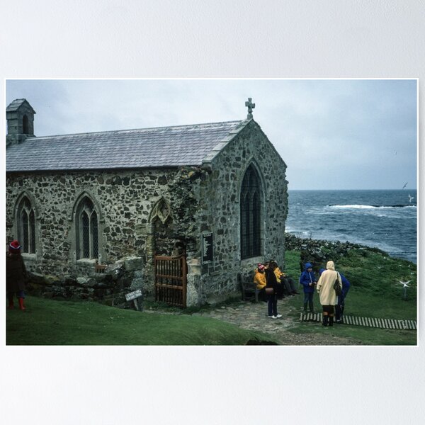 Item preview, People outside 1370 church in memory of St Cuthbert who died here 687 on Farne island off Sea Houses Bamburgh Northumberland England 19840528 0019m designed and sold by Fred Mitchell.