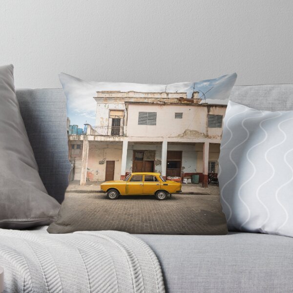 Bright yellow vintage car in La Havana, Cuba. Throw Pillow