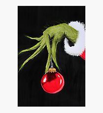 The hand of Grinch with Christmas tree ball Photographic Print
