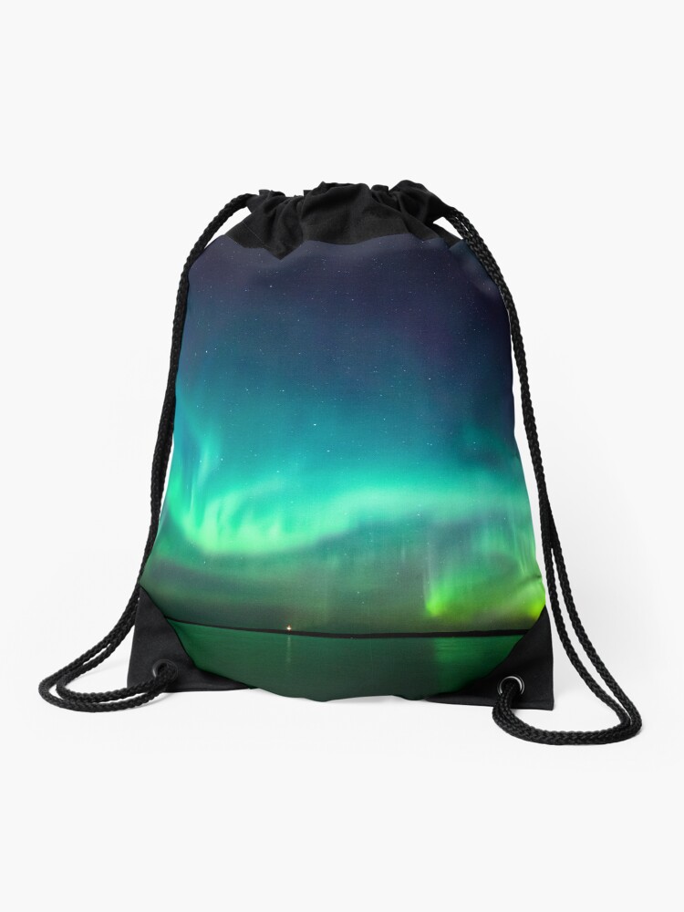 Thumbnail 1 of 3, Drawstring Bag, Northern lights glow over lake designed and sold by Juhani Viitanen.