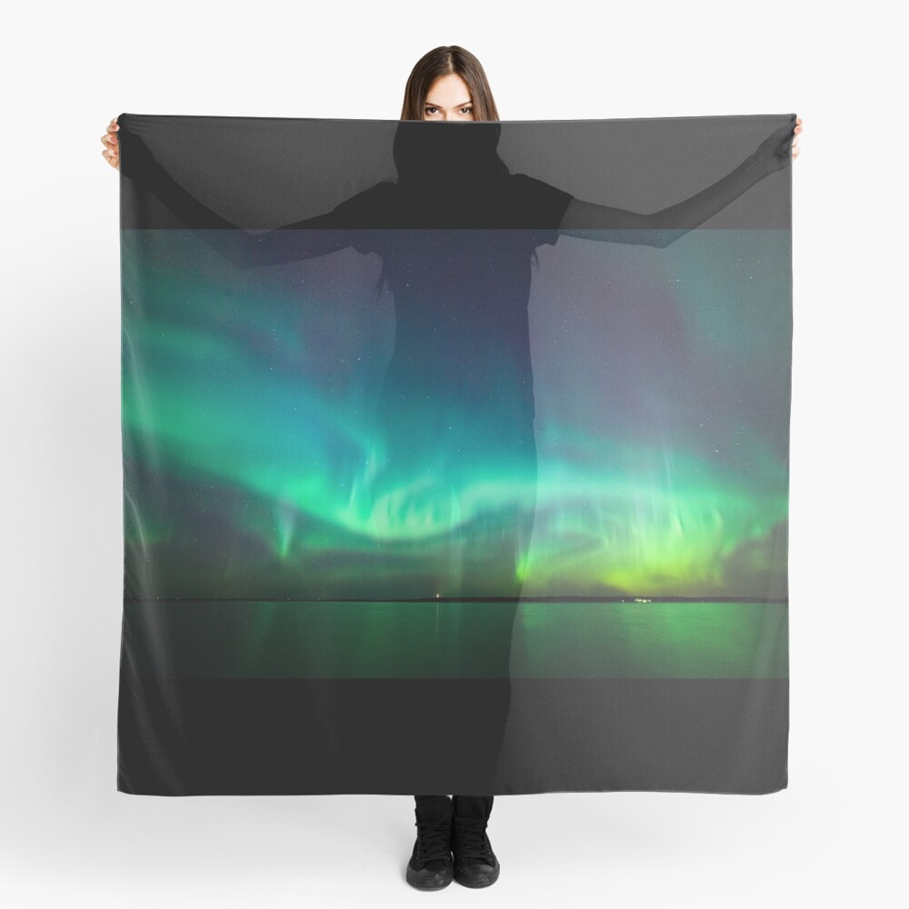 Northern lights glow over lake Scarf