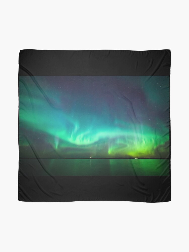 Alternate view of Northern lights glow over lake Scarf