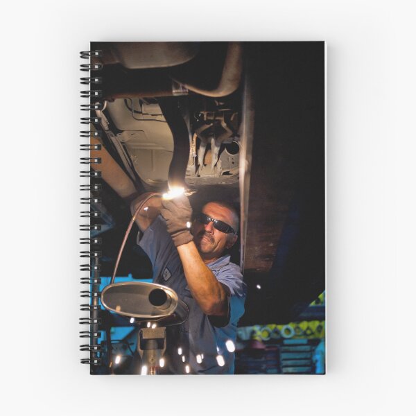 Item preview, Mechanic soldering a muffler designed and sold by Eyal Nahmias.
