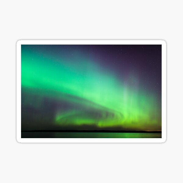 Northern lights over lake in Finland Sticker
