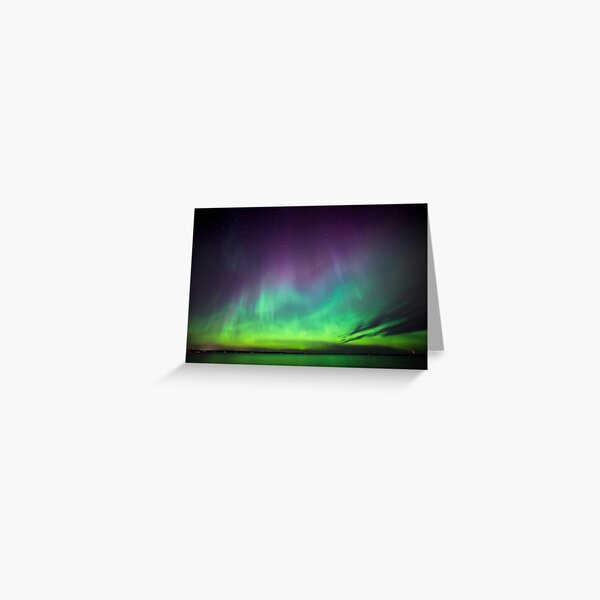 Beautiful northern lights over lake in Finland Greeting Card