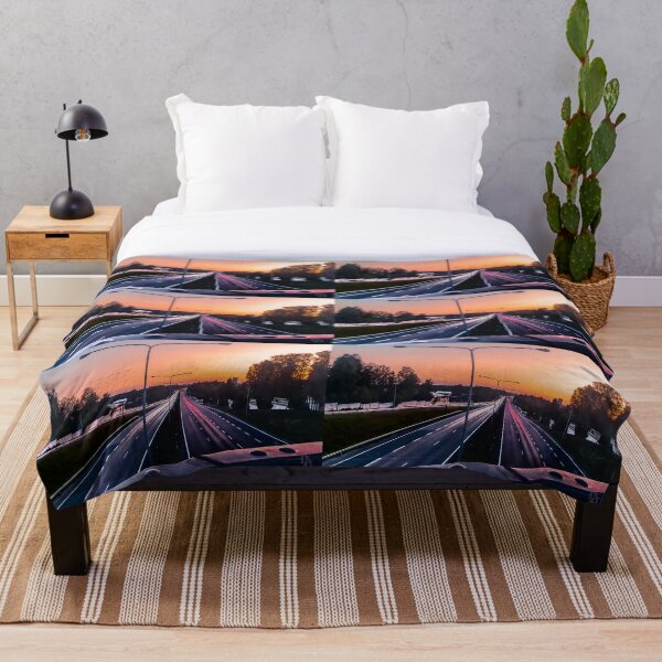 Light trail and sunset Throw Blanket