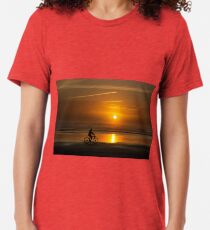 Silhouette of a cyclist along Cannon Beach Oregon Tri-blend T-Shirt