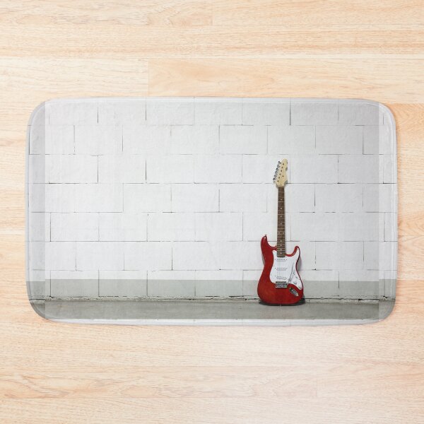 Item preview, Red electric guitar against white brick wall designed and sold by Lukasz Szczepanski.