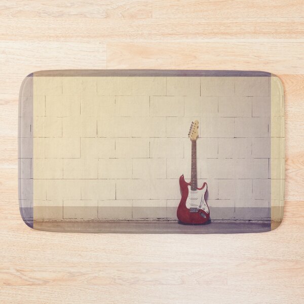 Item preview, Red electric guitar against white brick wall designed and sold by Lukasz Szczepanski.