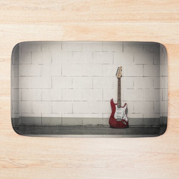 Item preview, Red electric guitar against white brick wall designed and sold by Lukasz Szczepanski.