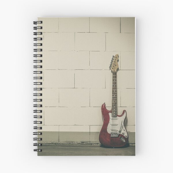 Item preview, Red electric guitar against white brick wall designed and sold by Lukasz Szczepanski.
