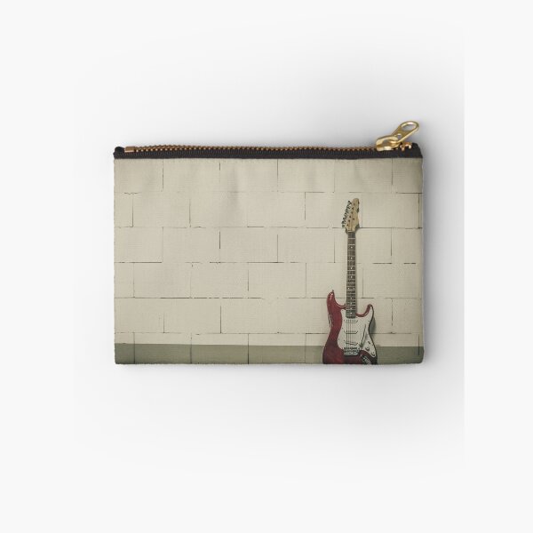 Item preview, Red electric guitar against white brick wall designed and sold by Lukasz Szczepanski.