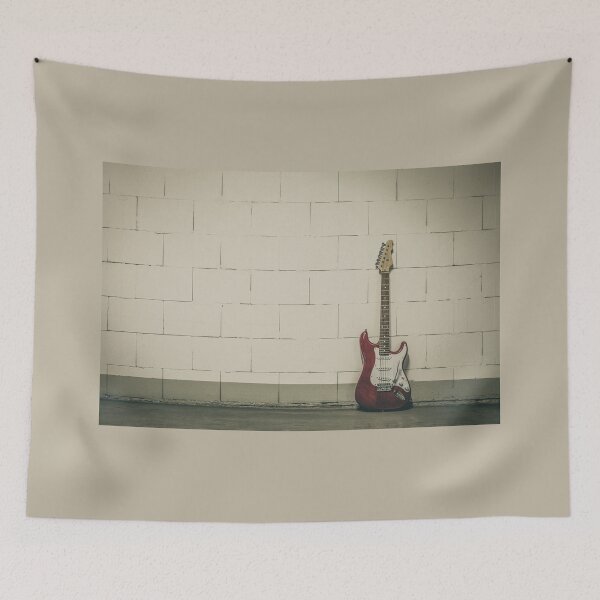 Item preview, Red electric guitar against white brick wall designed and sold by Lukasz Szczepanski.