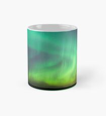Northern lights over lake in Finland Classic Mug