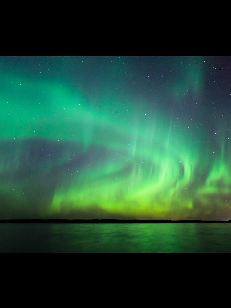 Northern lights over lake in Finland by Juhku
