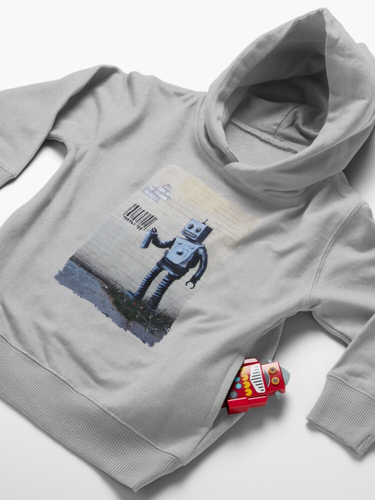 Alternate view of Banksy graffiti smiling Robot and barcodes Better Out Than In New York City residency on brick wall Toddler Pullover Hoodie