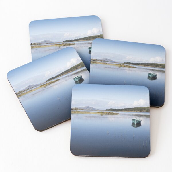 Item preview, A tranquil inland Scottish loch has a rowing boat with reflection. Mountains and forestry on the horizon with blue summer sky  designed and sold by Tony Skerl.
