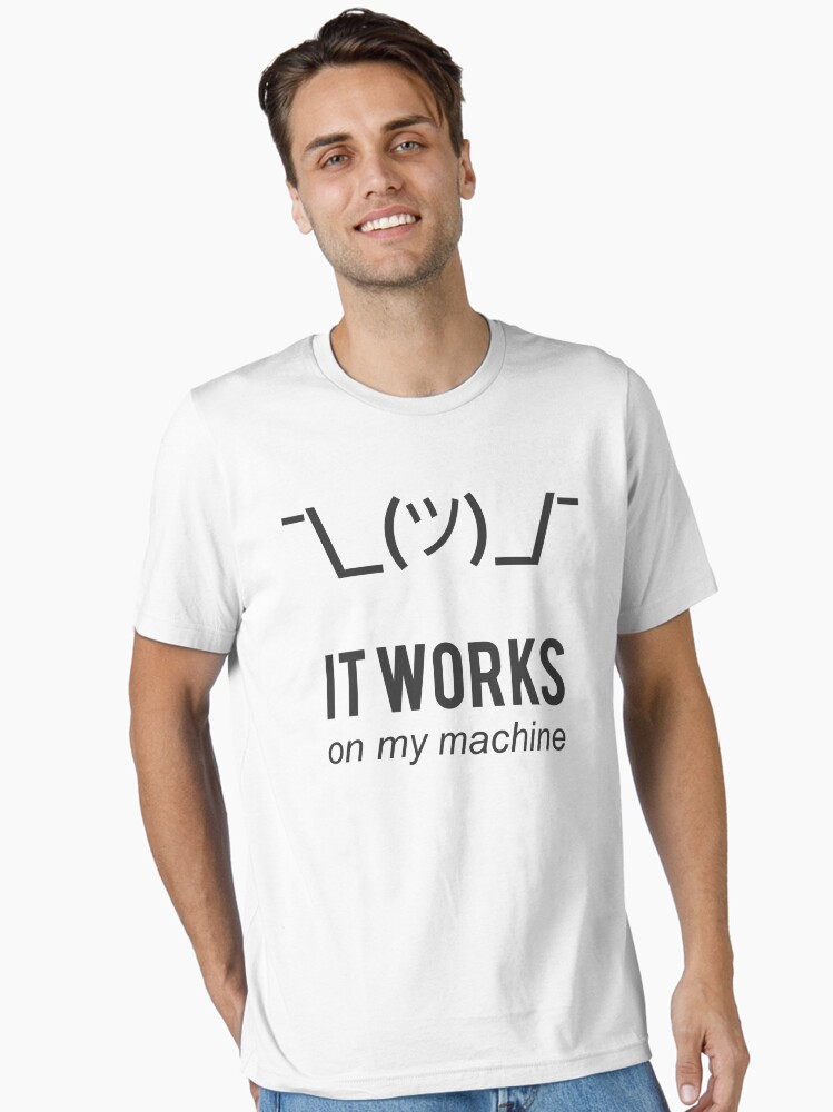 Thumbnail 1 of 7, Essential T-Shirt, Shrug It Works On My Machine Funny Programmer Excuse Black Design designed and sold by ramiro.