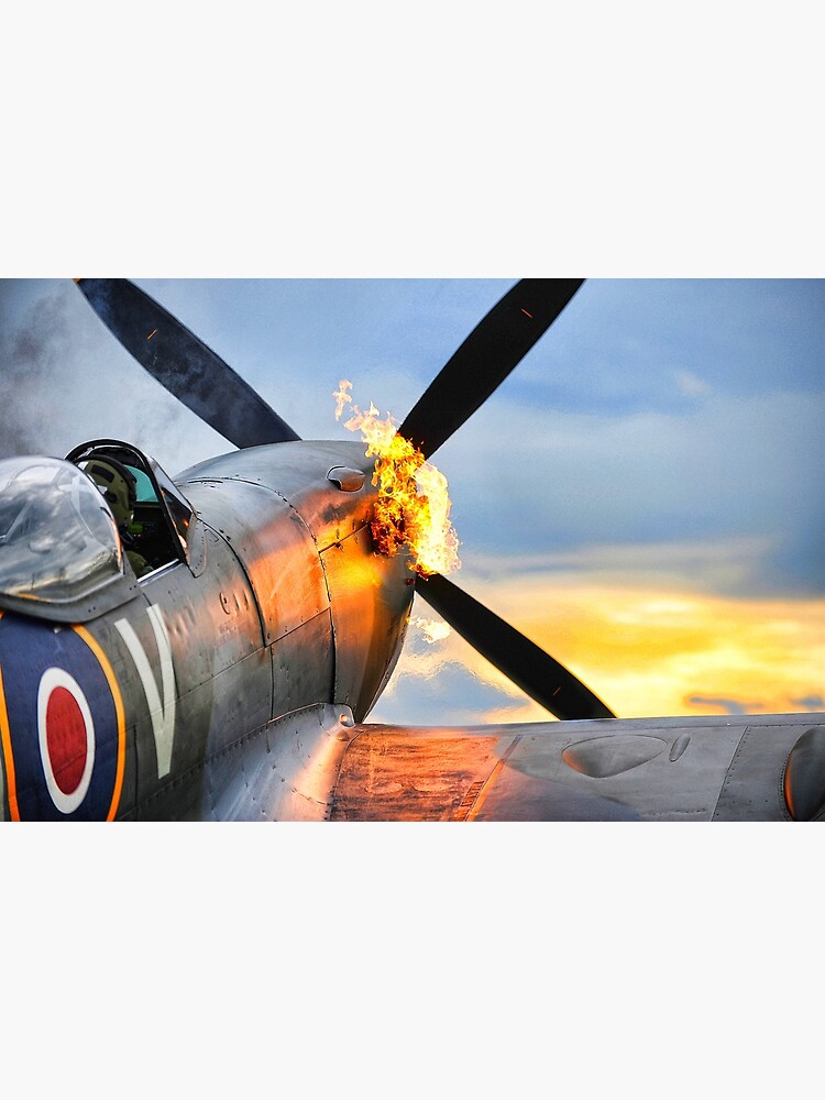 Spitfire airplane of the RAF doing a firy hot start showing flames by liesjes