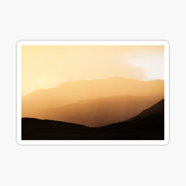 Highland mountain sunset through mist and rain Sticker