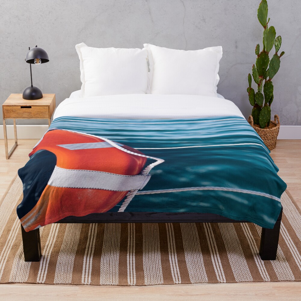 Seas The Day on a throw blanket