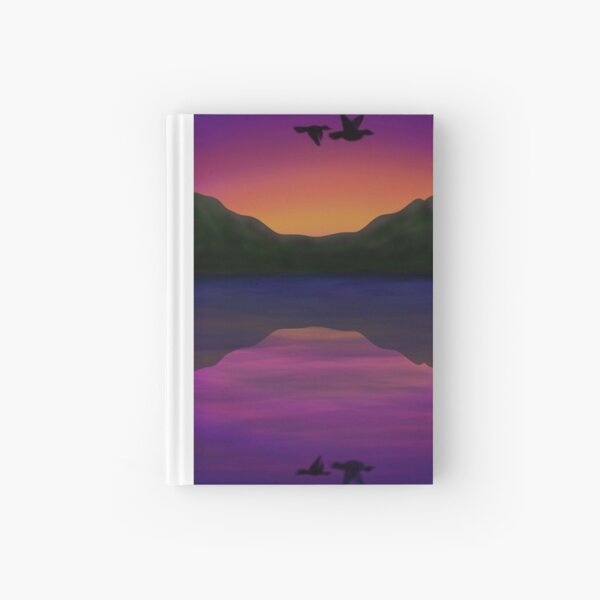 Birds flying above water at sunset Hardcover Journal