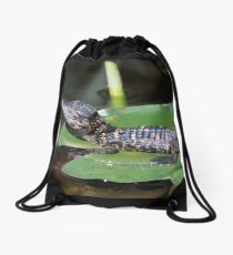 Smiling Baby Alligator Sleeping on Lilly Pad Drawstring Bag