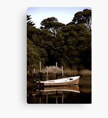 Wooden Boat on a Reflective River Canvas Print