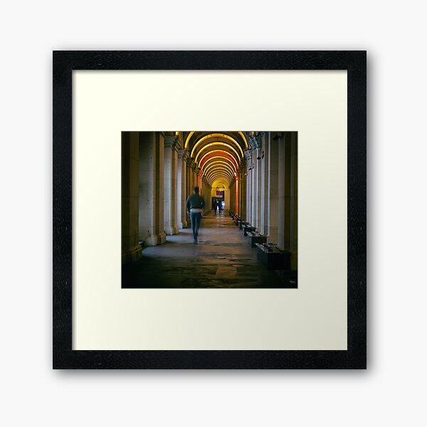 People walking down corridor Framed Art Print