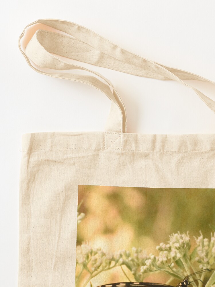 Alternate view of Monarch butterfly on white flowers Tote Bag