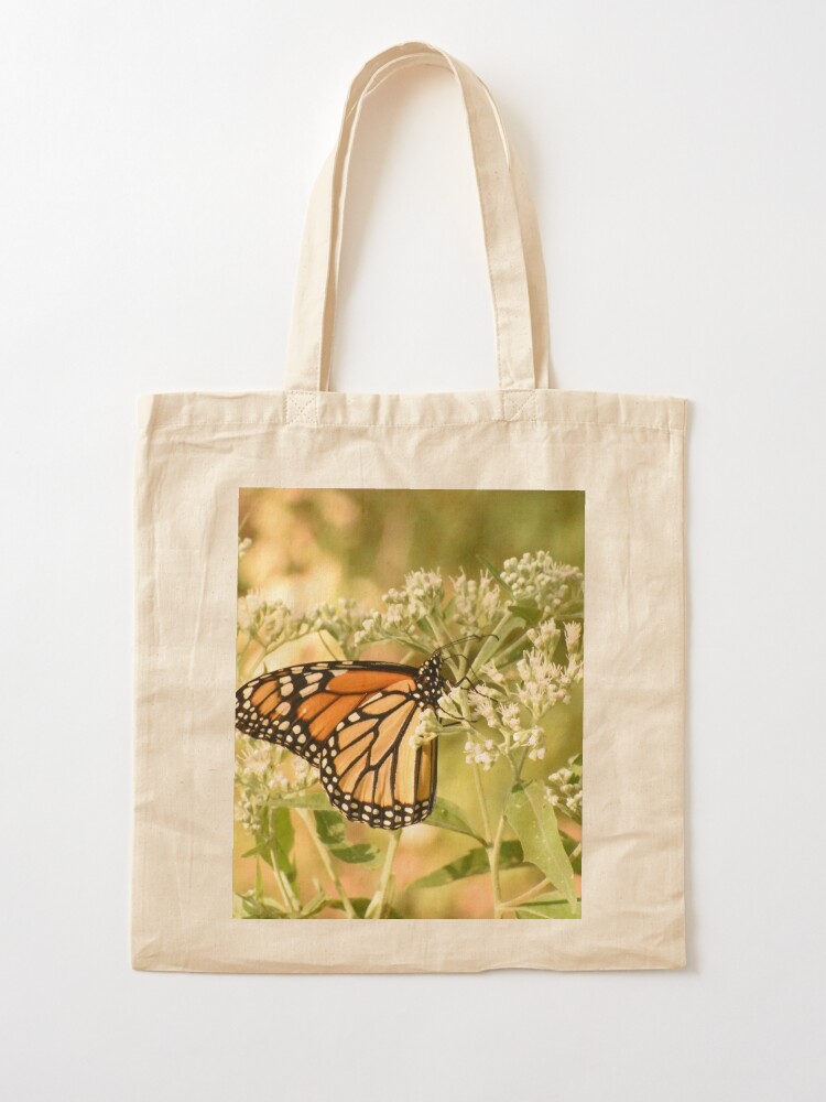 Alternate view of Monarch butterfly on white flowers Tote Bag