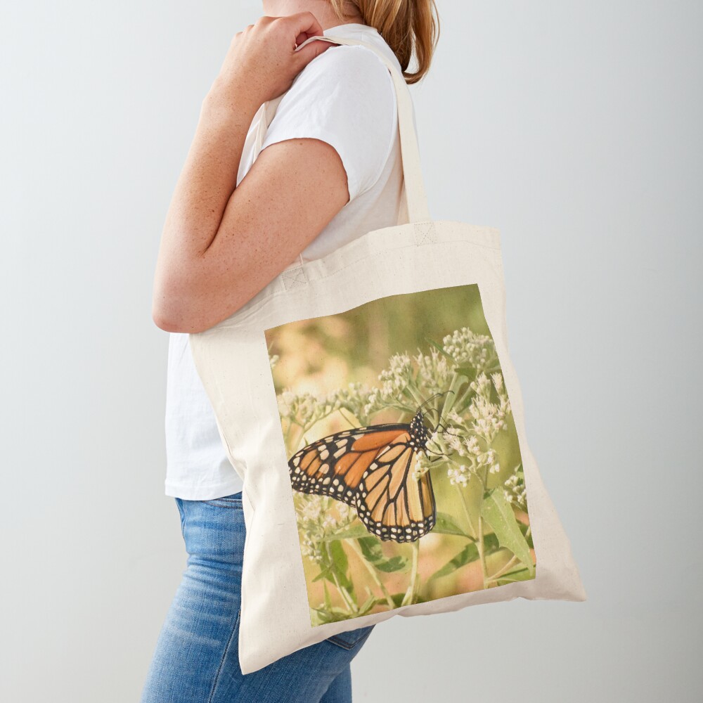 Monarch butterfly on white flowers Tote Bag
