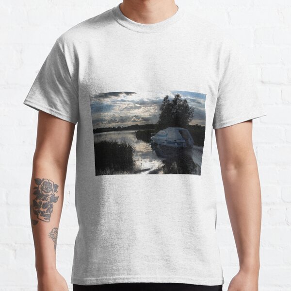 A boat travelling the Norfolk Broads near dusk Classic T-Shirt