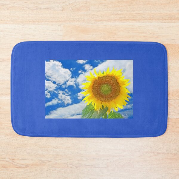 Item preview, Sunflower against of blue sky and white clouds. designed and sold by IaroslavB.