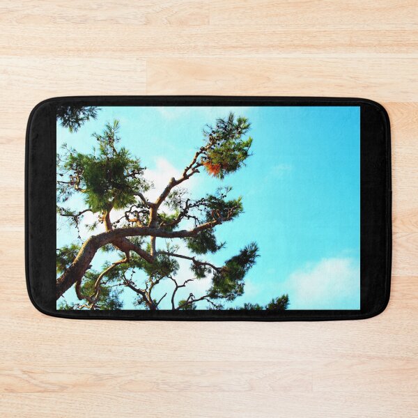 Item preview, Curved sea pine branch with cones and the azure sky in the background designed and sold by Kristina Drozd.
