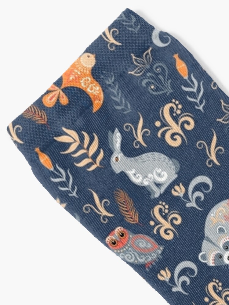Alternate view of Fairy-tale forest. Fox, bear, raccoon, owls, rabbits, flowers and herbs on a blue background. Socks