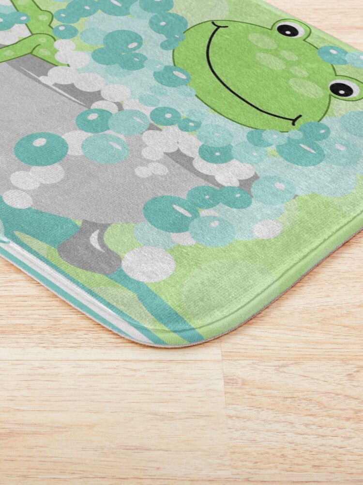 "Cute Green Frog in a Bathtub of Bubbles" Bath Mat for Sale by