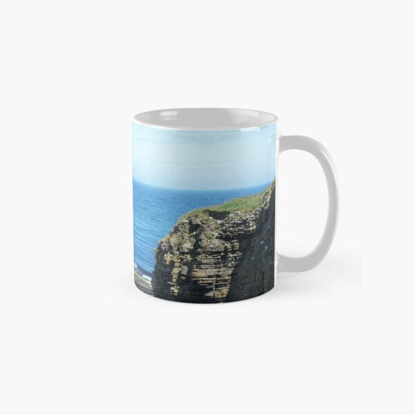 Rocks and raised ledge in sea Classic Mug