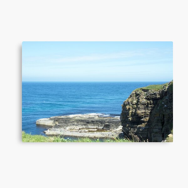 Rocks and raised ledge in sea Canvas Print