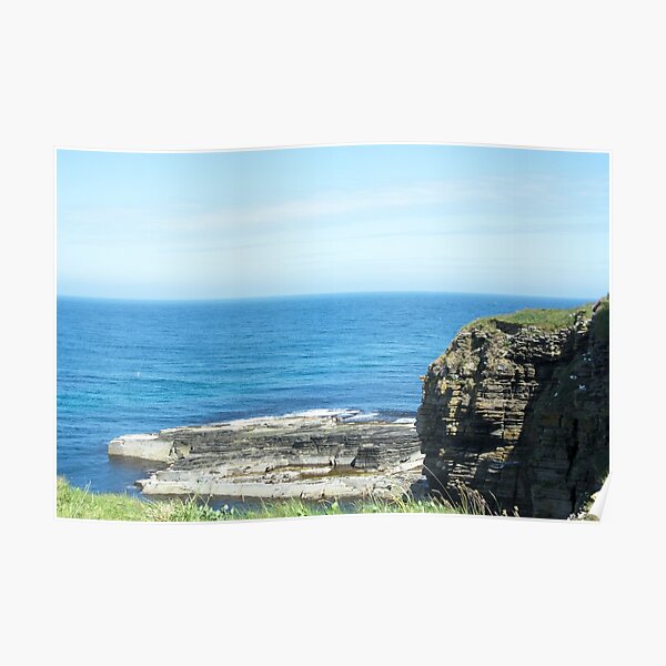 Rocks and raised ledge in sea Poster