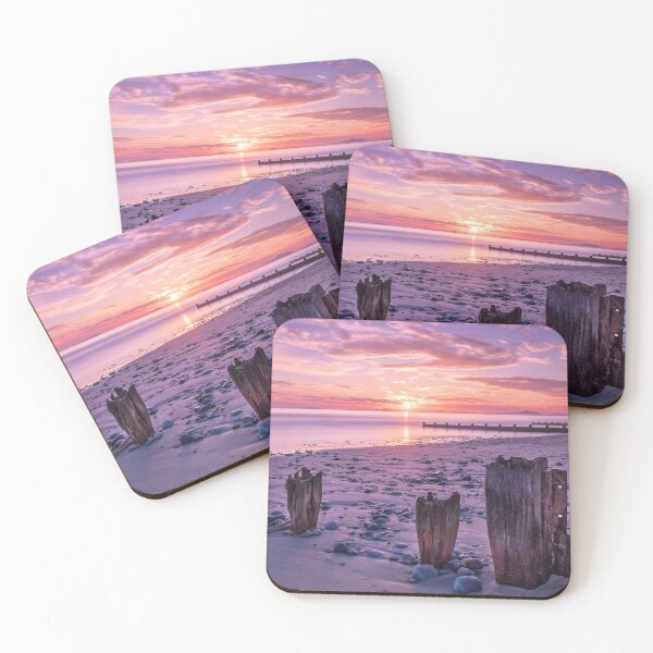 Item preview, Sunset and red sky over groynes and sand at Barmouth beach designed and sold by polycup1.