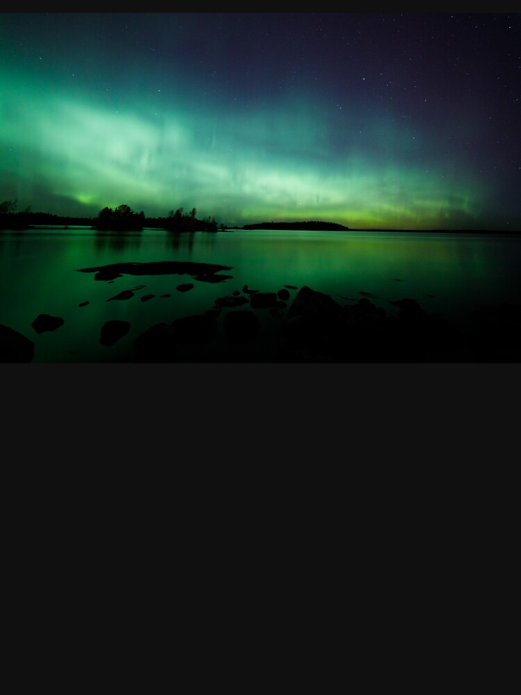 Beautiful northern lights over lake by Juhku