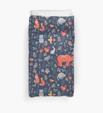 Fairy-tale forest. Fox, bear, raccoon, owls, rabbits, flowers and herbs on a blue background. Duvet Cover