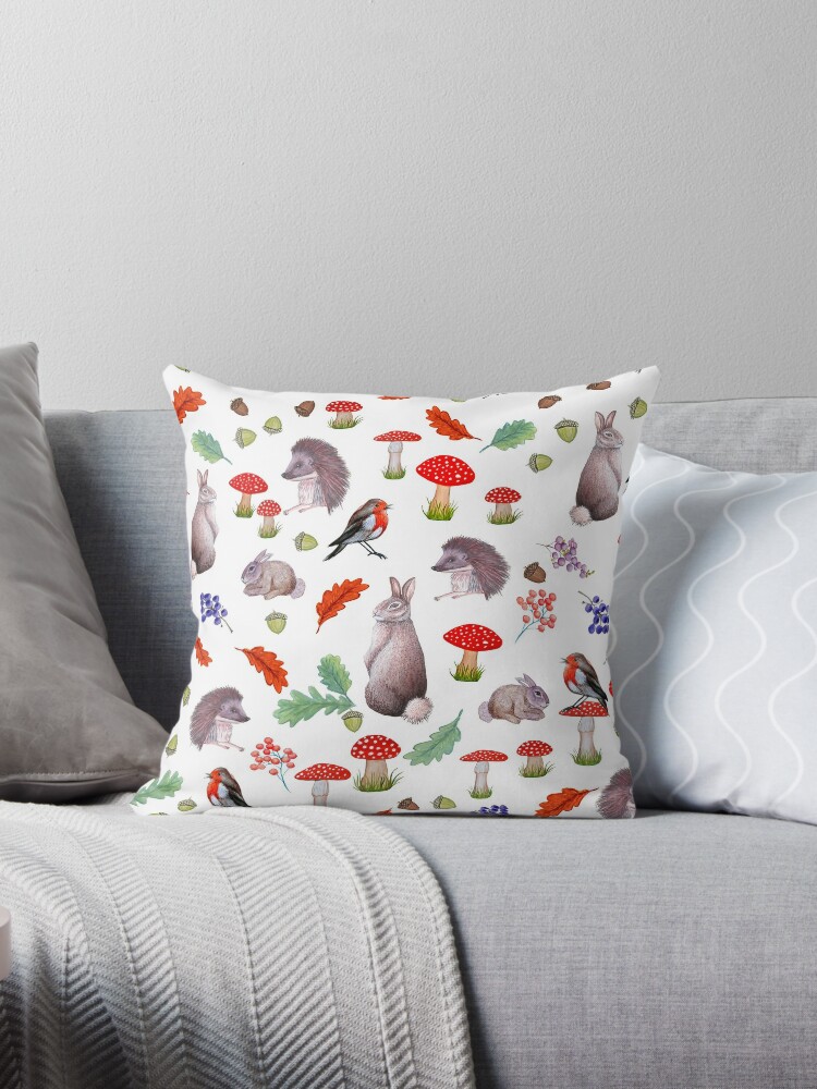 Throw Pillow, Rabbit, hedgehog and Robin with red mushrooms, Autumn leaves and berries designed and sold by MagentaRose
